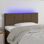 sengegavl med LED-lys 90x5x78/88 cm stof mørkebrun
