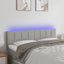 sengegavl med LED-lys 144x5x78/88 cm stof lysegrå