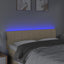 sengegavl med LED-lys 144x5x78/88 cm stof cremefarvet