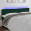 sengegavl med LED-lys 160x5x78/88 cm fløjl mørkegrøn