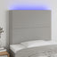 sengegavl med LED-lys 90x5x118/128 cm stof lysegrå