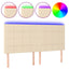 sengegavl med LED-lys 180x5x118/128 cm stof cremefarvet