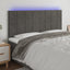 sengegavl med LED-lys 160x5x118/128 cm fløjl mørkegrå
