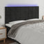 sengegavl med LED-lys 200x5x118/128 cm fløjl sort