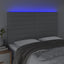 sengegavl med LED-lys 144x5x118/128 cm stof lysegrå
