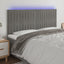 sengegavl med LED-lys 180x5x118/128 cm fløjl lysegrå