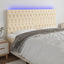 sengegavl med LED-lys 180x7x118/128 cm stof cremefarvet