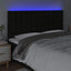 sengegavl med LED-lys 160x5x118/128 cm stof sort