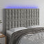 sengegavl med LED-lys 144x5x118/128 cm fløjl lysegrå