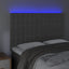 sengegavl med LED-lys 144x5x118/128 cm fløjl mørkegrå