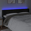 sengegavl med LED-lys 203x16x78/88 cm fløjl sort