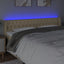 sengegavl med LED-lys 183x16x78/88 cm stof cremefarvet