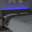 sengegavl med LED-lys 203x16x78/88 cm stof gråbrun