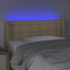 sengegavl med LED-lys 103x16x78/88 cm stof cremefarvet