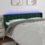 sengegavl med LED-lys 163x16x78/88 cm fløjl mørkegrøn