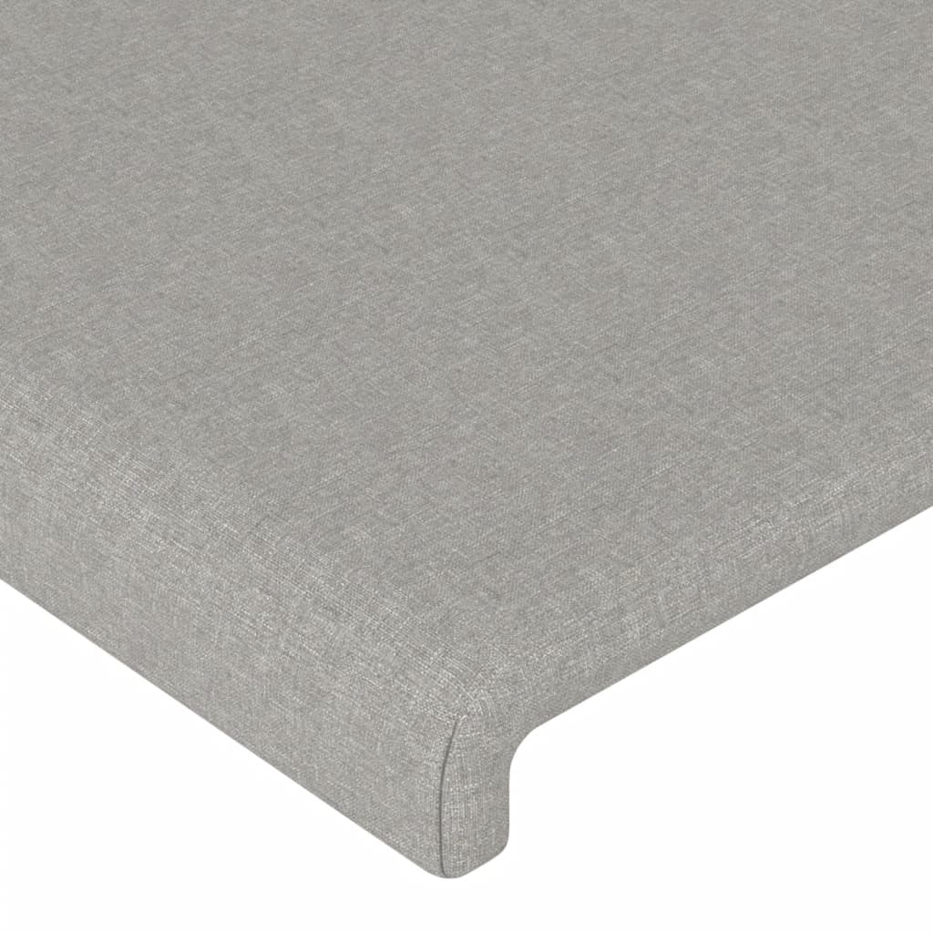 sengegavl med LED-lys 163x16x118/128 cm stof lysegrå