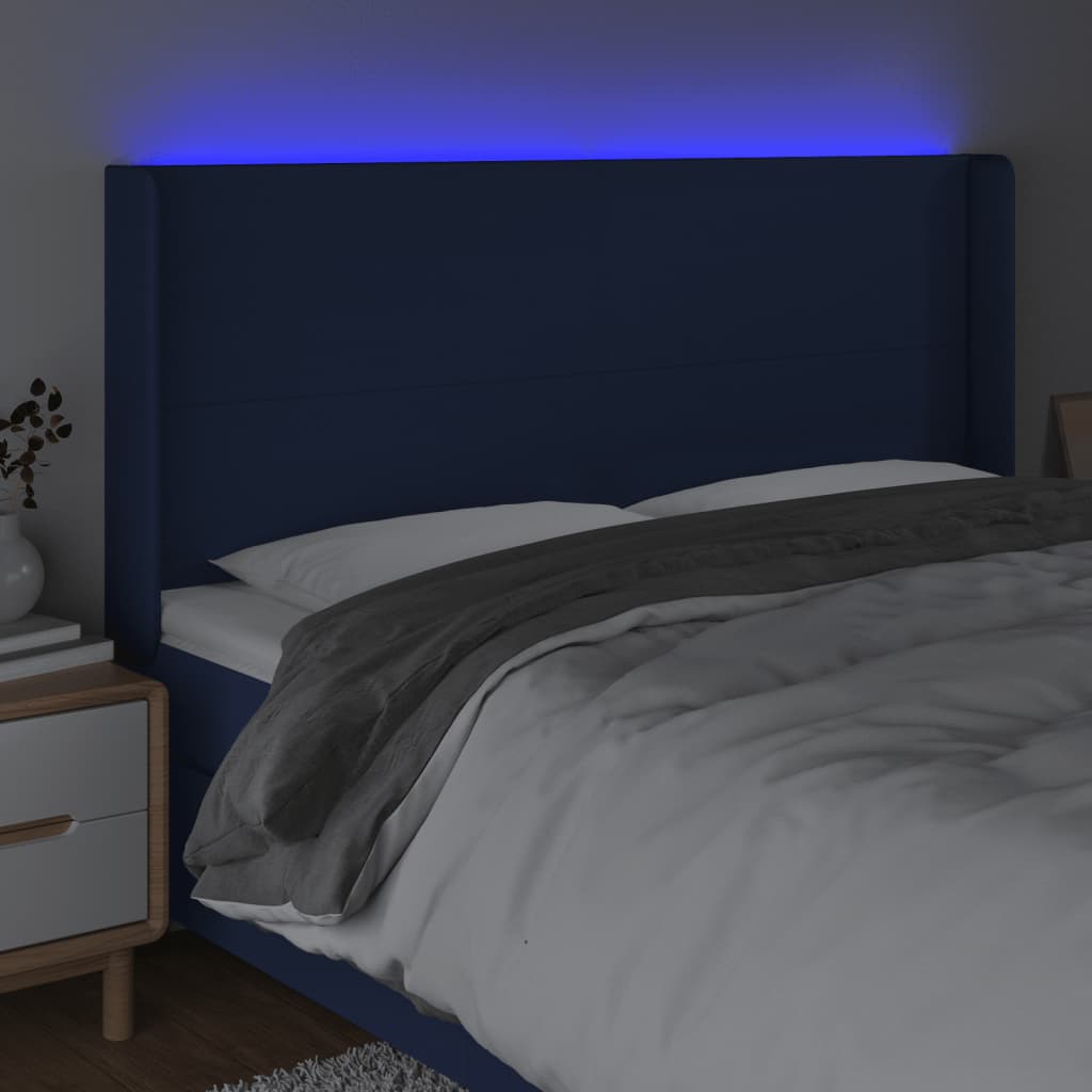 sengegavl med LED-lys 163x16x118/128 cm stof blå