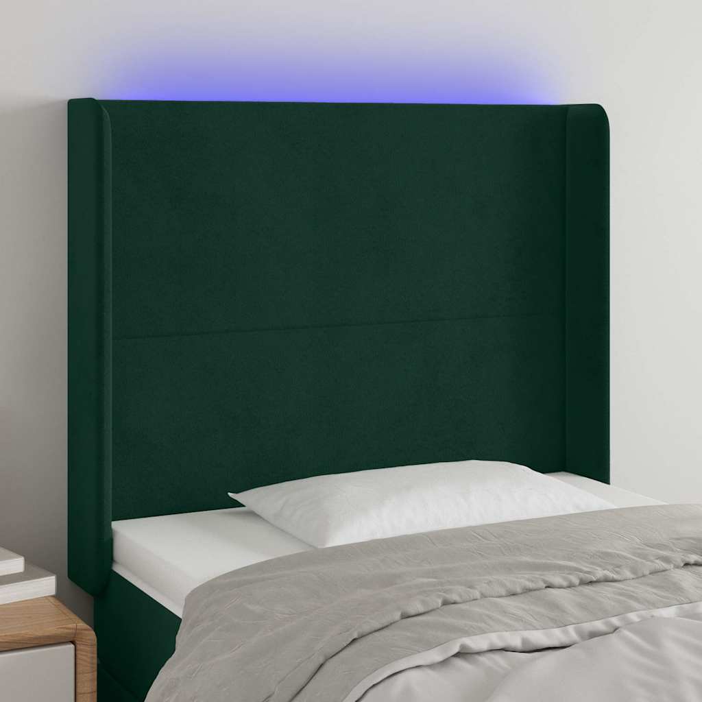 sengegavl med LED-lys 83x16x118/128 cm fløjl mørkegrøn