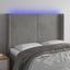 sengegavl med LED-lys 147x16x118/128 cm fløjl lysegrå