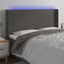 sengegavl med LED-lys 163x16x118/128 cm fløjl mørkegrå