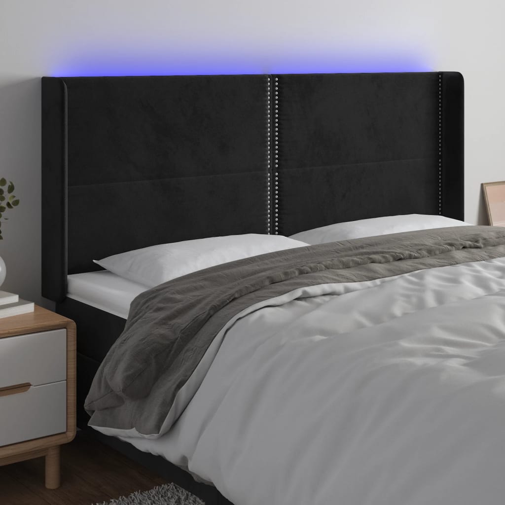 sengegavl med LED-lys 203x16x118/128 cm fløjl sort