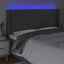 sengegavl med LED-lys 163x16x118/128 cm stof mørkegrå
