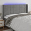 sengegavl med LED-lys 203x16x118/128 cm stof mørkegrå