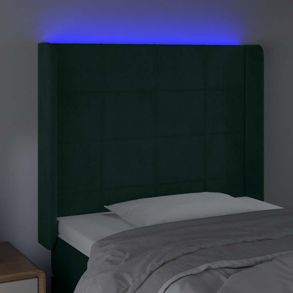 sengegavl med LED-lys 83x16x118/128 cm fløjl mørkegrøn