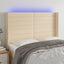 sengegavl med LED-lys 147x16x118/128 cm stof cremefarvet