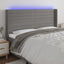 sengegavl med LED-lys 203x16x118/128 cm stof mørkegrå