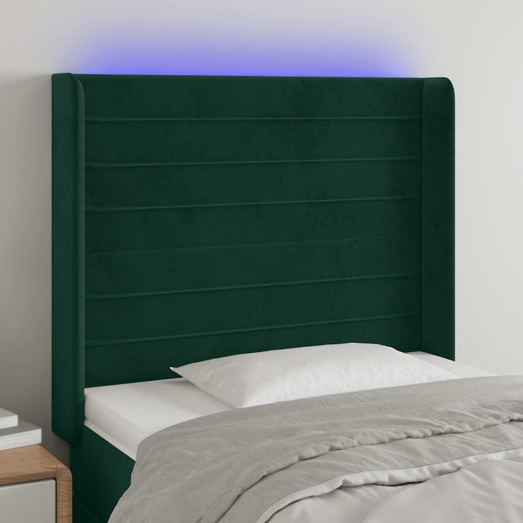 sengegavl med LED-lys 83x16x118/128 cm fløjl mørkegrøn
