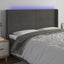 sengegavl med LED-lys 183x16x118/128 cm fløjl mørkegrå