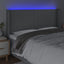 sengegavl med LED-lys 183x16x118/128 cm stof lysegrå