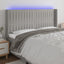 sengegavl med LED-lys 183x16x118/128 cm stof lysegrå