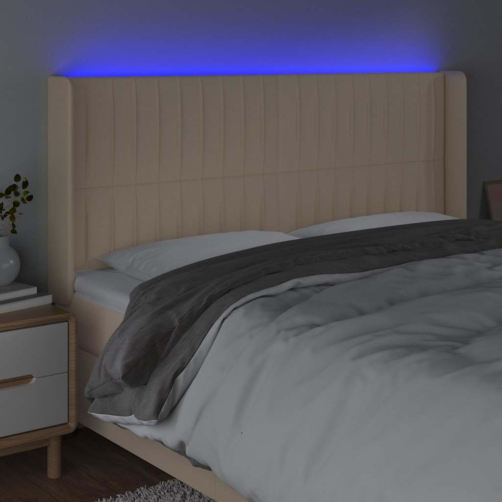 sengegavl med LED-lys 183x16x118/128 cm stof cremefarvet