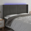 sengegavl med LED-lys 183x16x118/128 cm fløjl mørkegrå