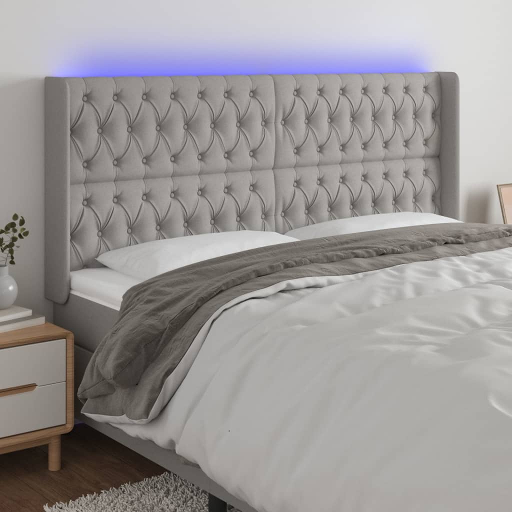 sengegavl med LED-lys 183x16x118/128 cm stof lysegrå
