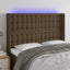 sengegavl med LED-lys 147x16x118/128 cm stof mørkebrun