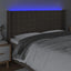sengegavl med LED-lys 163x16x118/128 cm stof gråbrun
