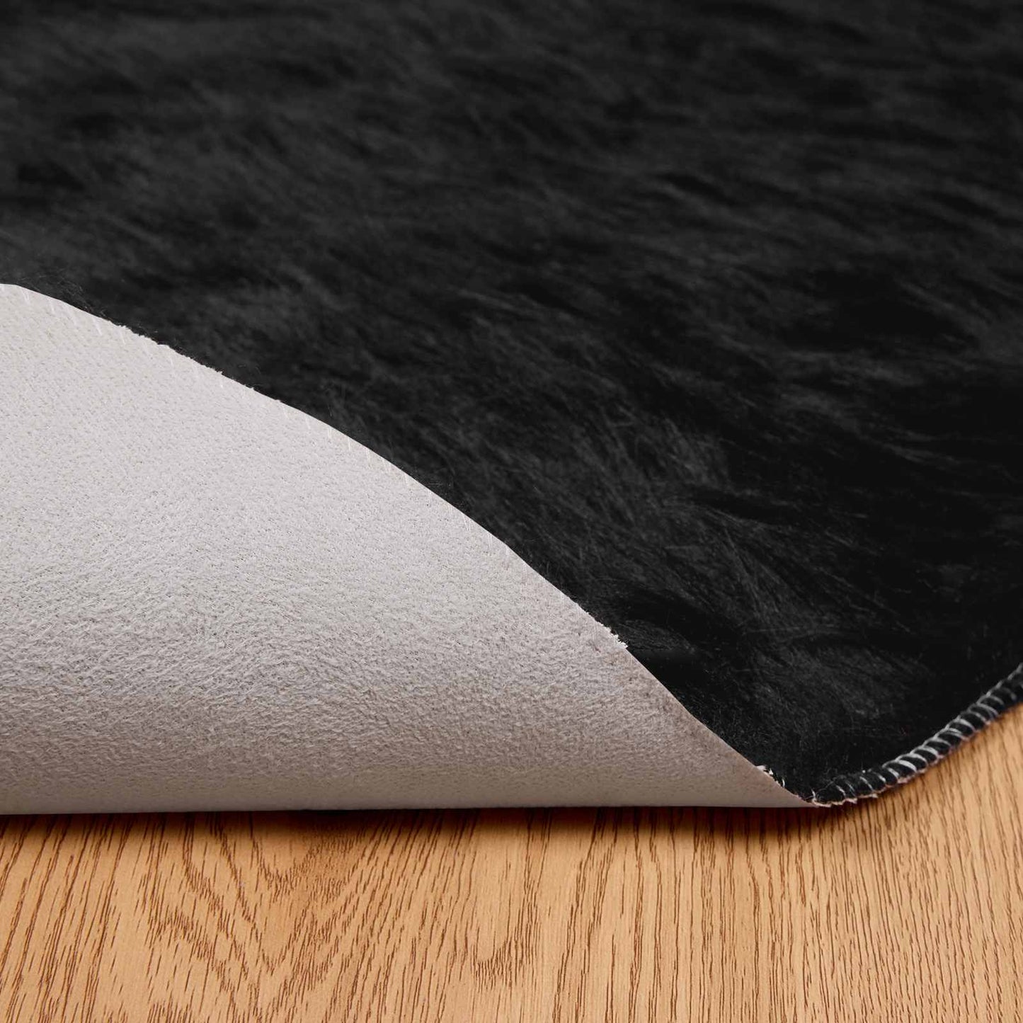 Fuskobbel lammeskindstæppe TAFALLA Sort Ø 100 cm Polyester