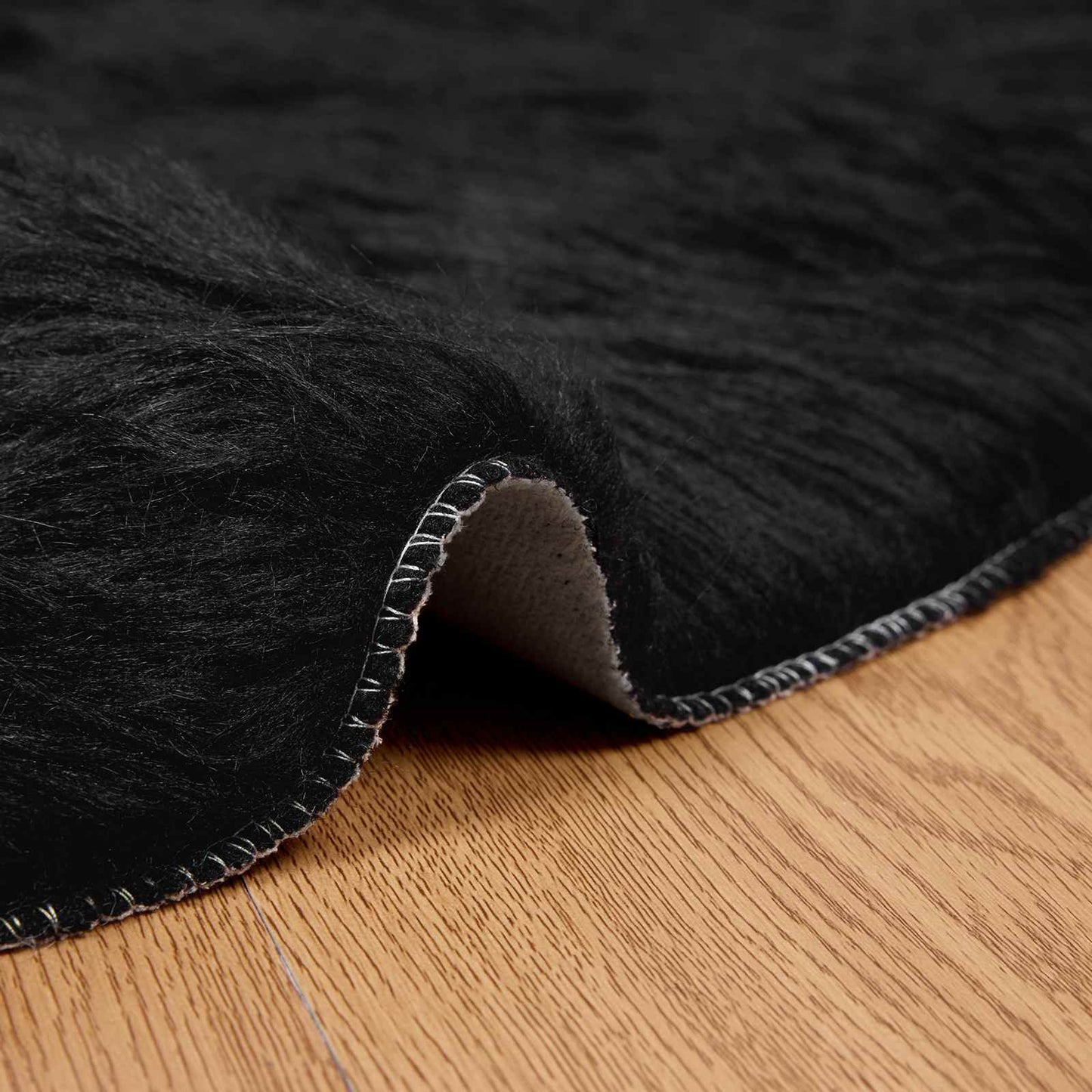 Fuskobbel lammeskindstæppe TAFALLA Sort Ø 120 cm Polyester